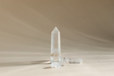 Photo of Aura. Many beautiful crystals on beige background