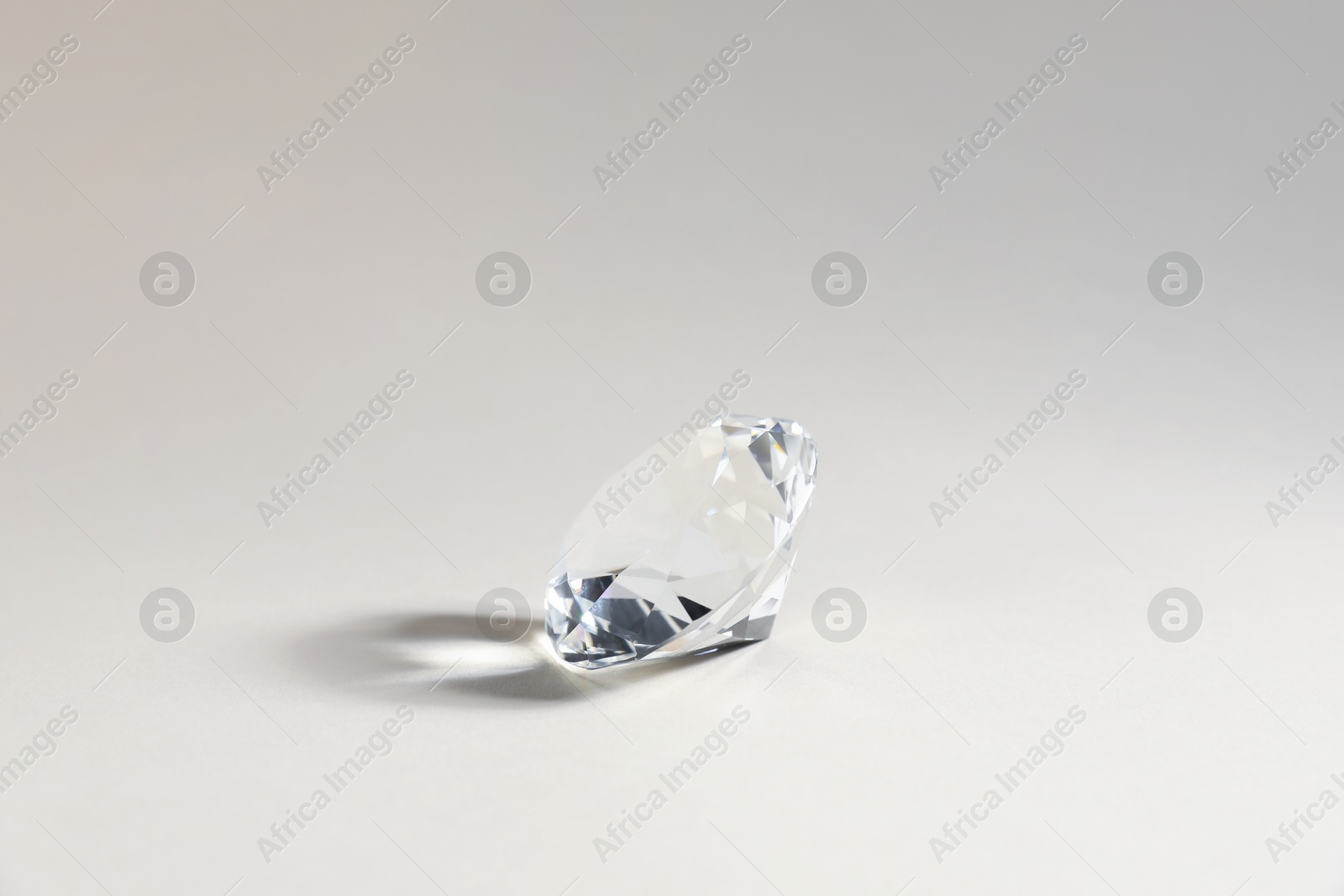 Photo of Aura. One beautiful diamond on light background