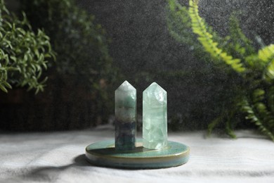 Photo of Aura. Two beautiful crystal on beige fabric