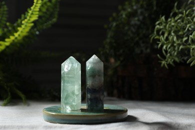 Photo of Aura. Two beautiful crystal on beige fabric