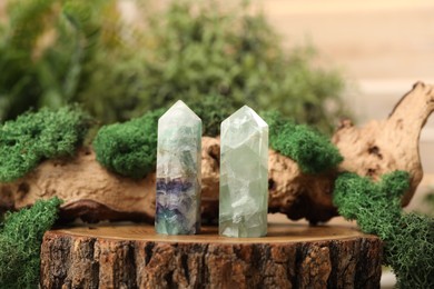 Photo of Aura. Beautiful crystals and driftwood with moss on stump