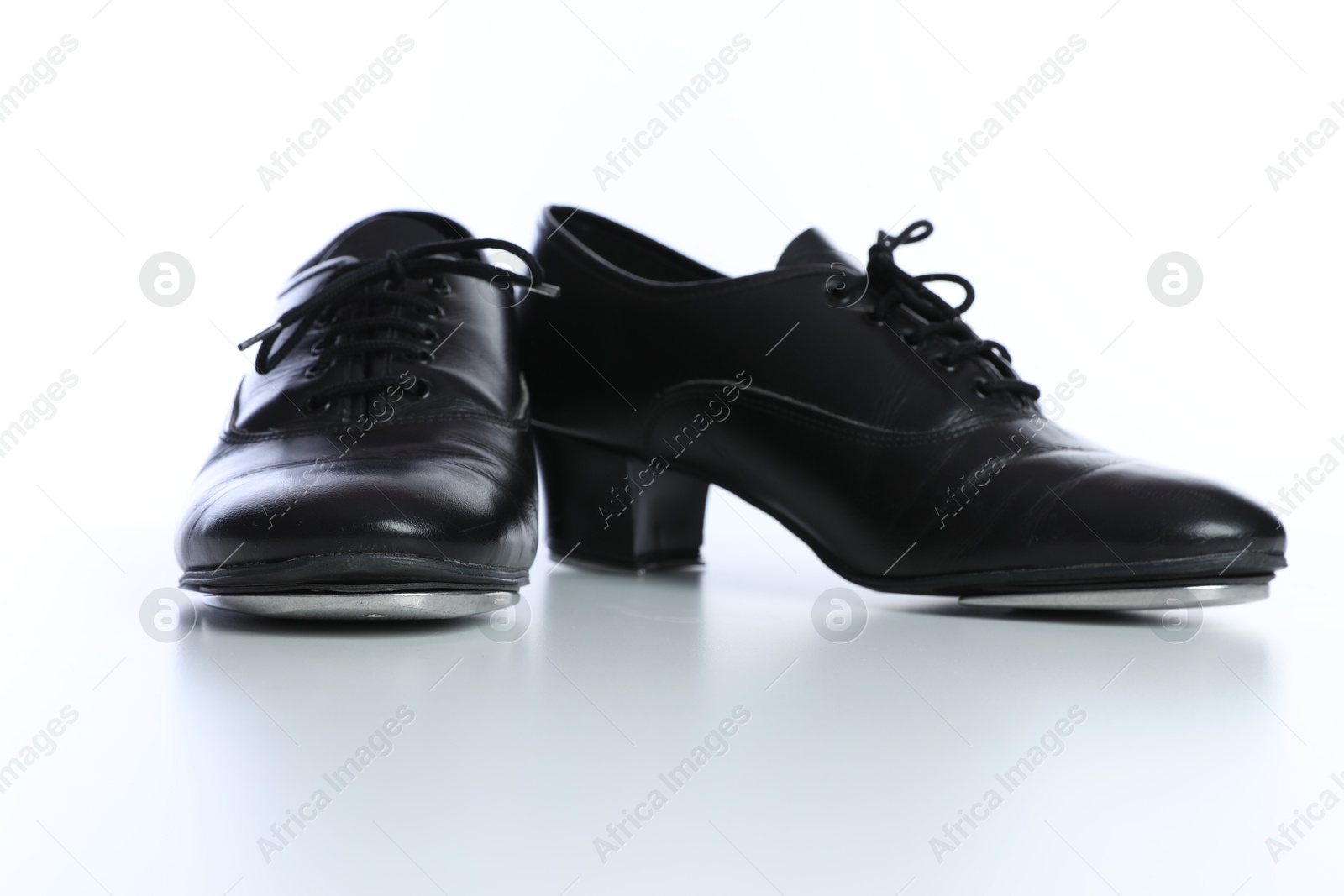 Pair of tap shoes isolated on white. Tap dance Photo of Pair of tap shoes isolated on white. Tap dance