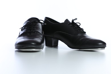 Photo of Pair of tap shoes isolated on white. Tap dance