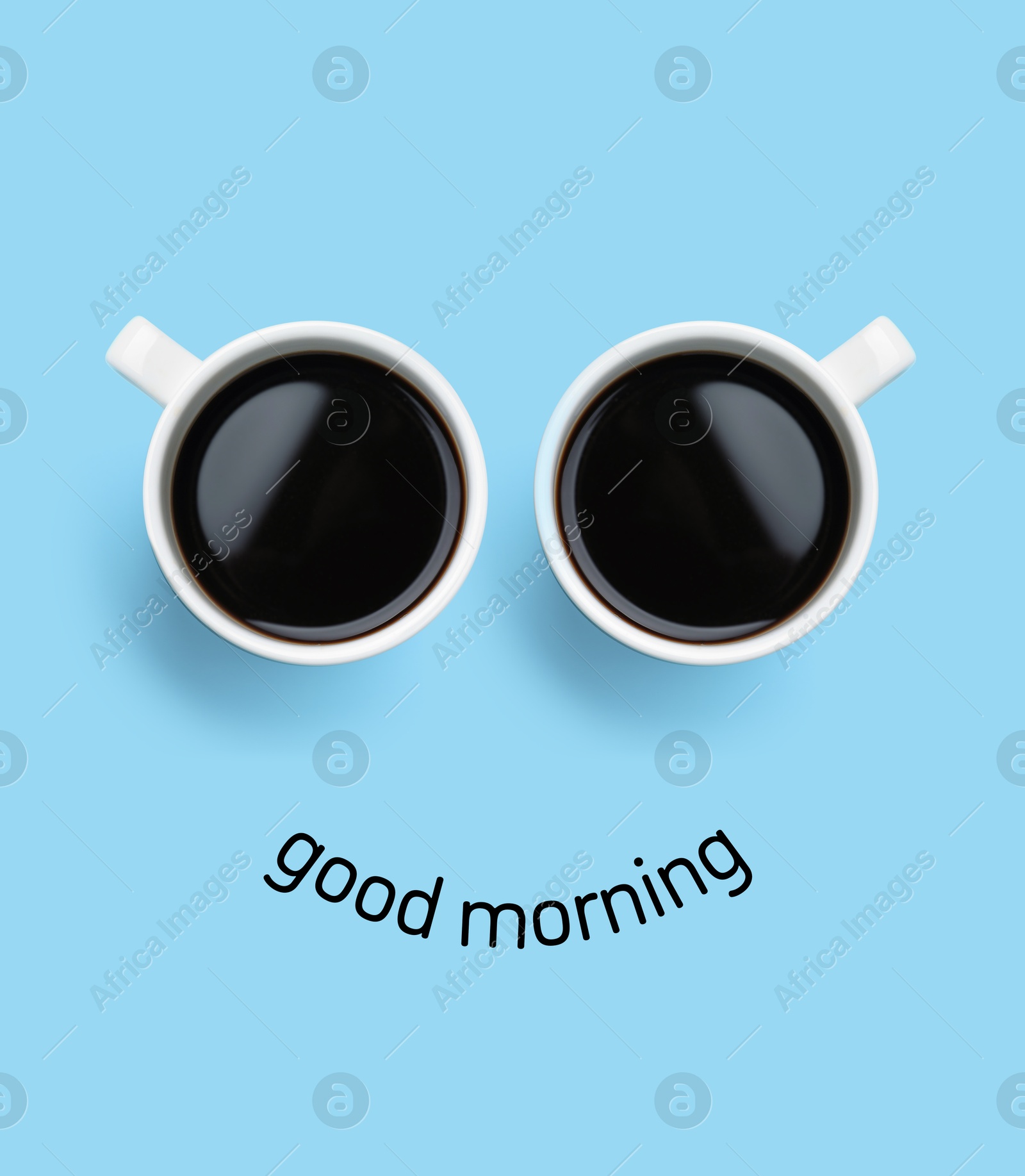 Image of Coffee in cups as eyes and phrase Good Morning as smile. Cute card or poster design on light blue background, top view