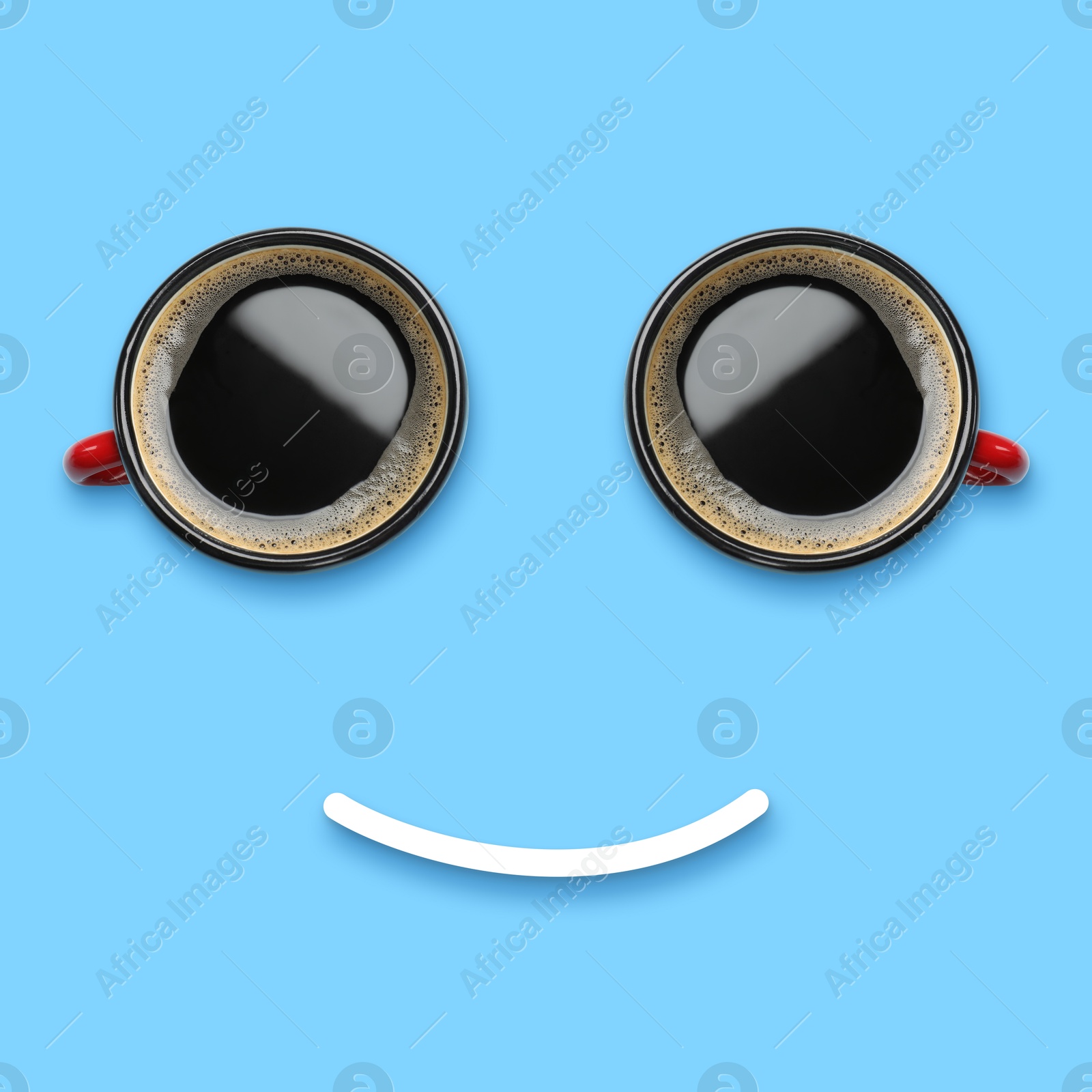 Image of Coffee in cups and line making smiling face on light blue background, top view
