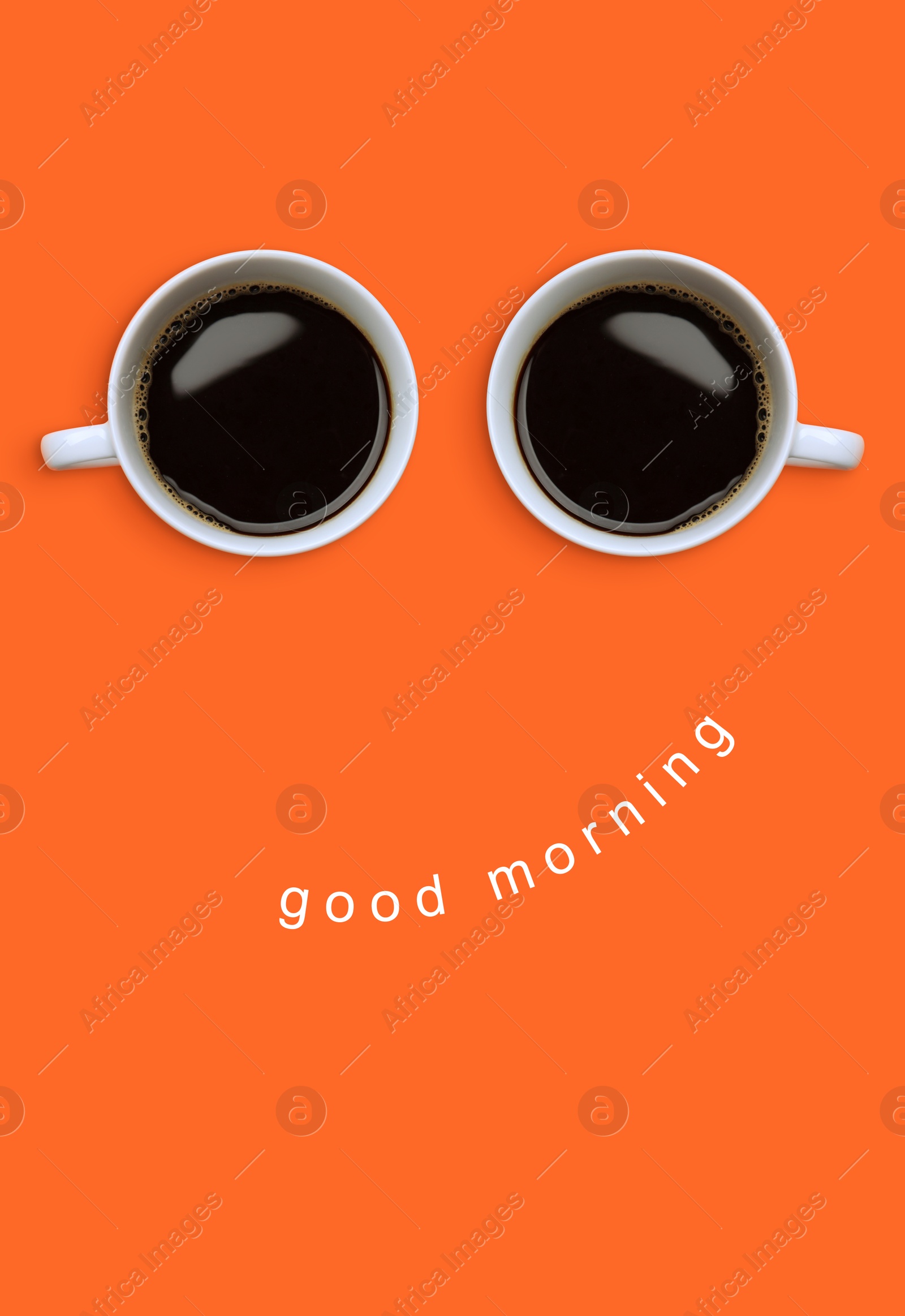 Image of Coffee in cups as eyes and phrase Good Morning as smile. Cute card or poster design on coral background, top view
