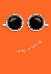 Image of Coffee in cups as eyes and phrase Good Morning as smile. Cute card or poster design on coral background, top view