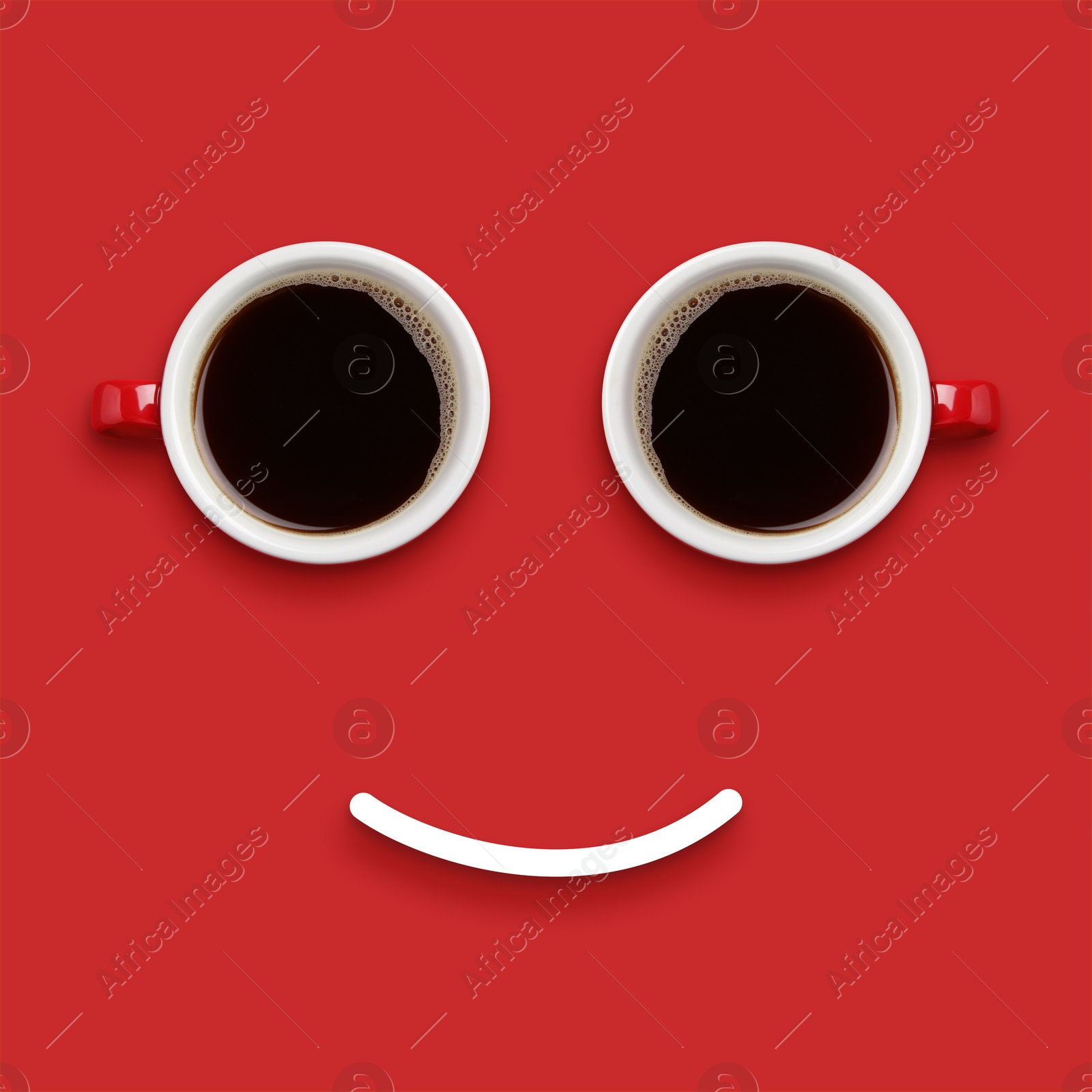 Image of Coffee in cups and line making smiling face on red background, top view