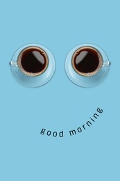 Image of Coffee in cups as eyes and phrase Good Morning as smile. Cute card or poster design on light blue background, top view