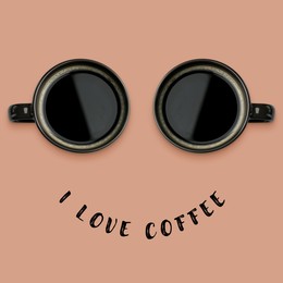 Image of I love coffee poster with happy face. Phrase as smile and coffee in cups as eyes on pink beige background, top view