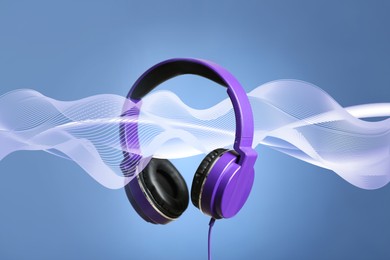 Image of Headphones and sound waves against greyish blue background