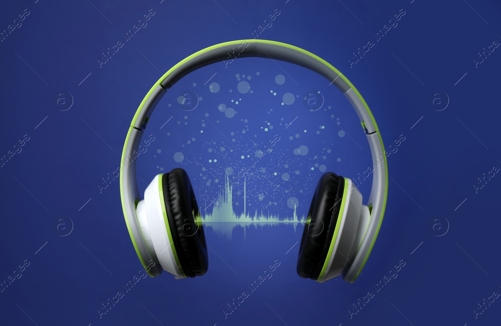 Image of Headphones and sound waves against blue background