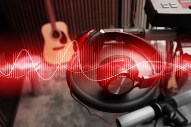 Image of Headphones, electronic drum kit and sound waves