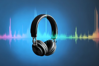 Image of Headphones and sound waves against blue gradient background