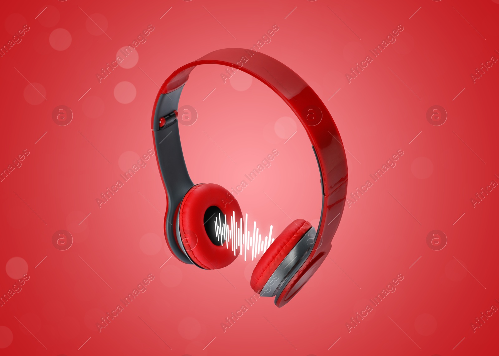 Image of Headphones and sound waves against red gradient background