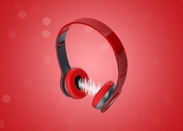 Image of Headphones and sound waves against red gradient background