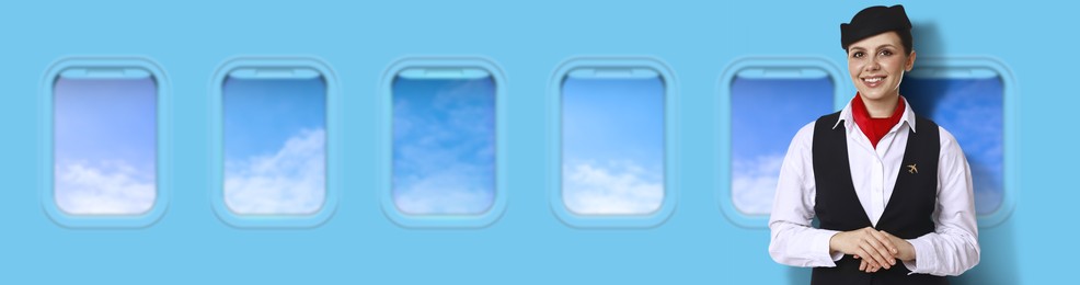 Image of Air hostess smiling near windows in plane