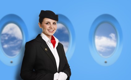 Image of Air hostess smiling near windows in plane