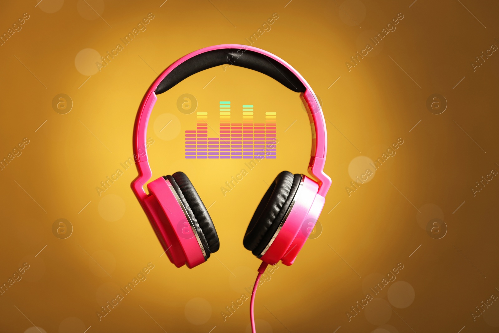 Image of Headphones and sound waves against orange gradient background