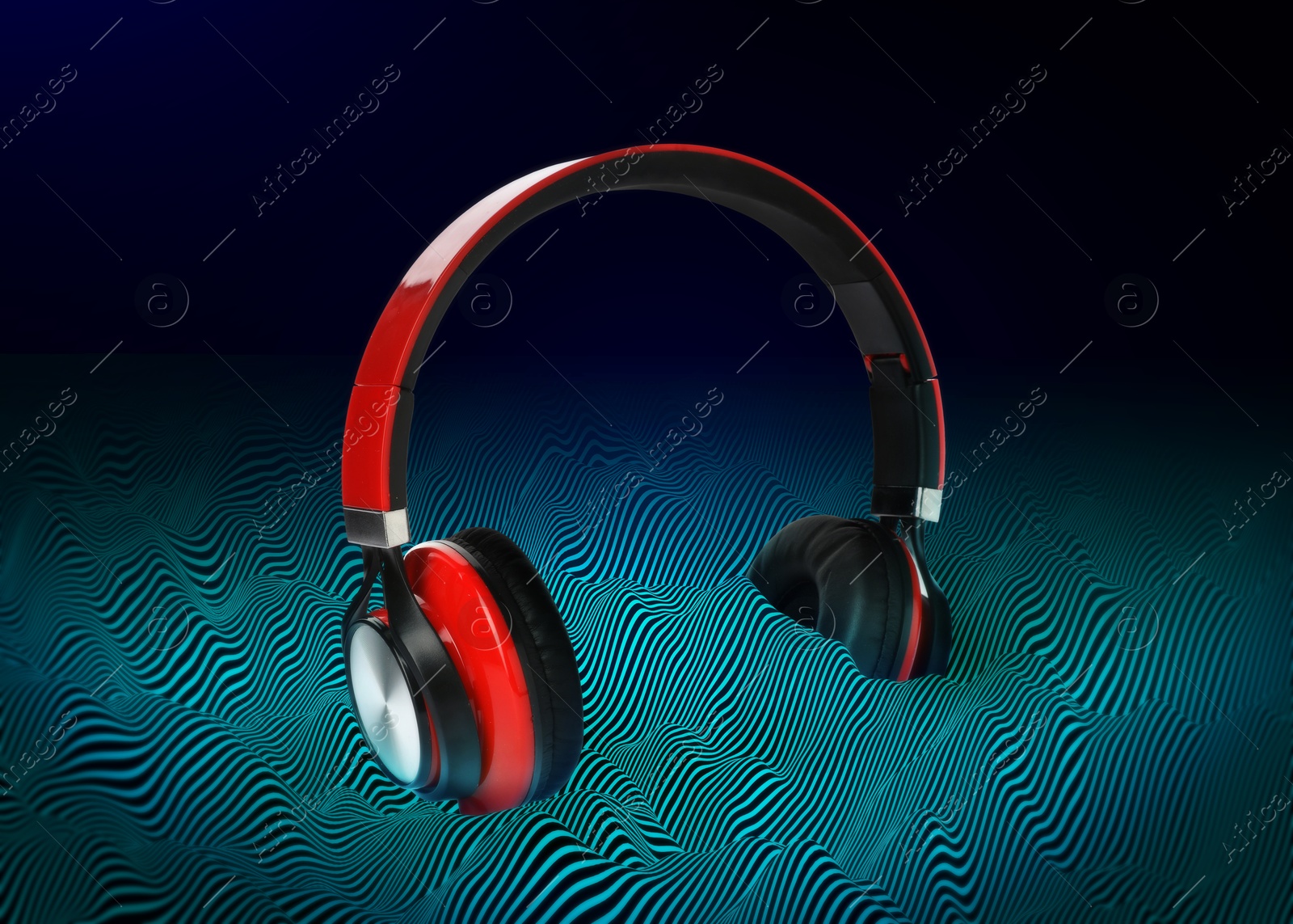 Image of Headphones drowning in sound waves against gradient background