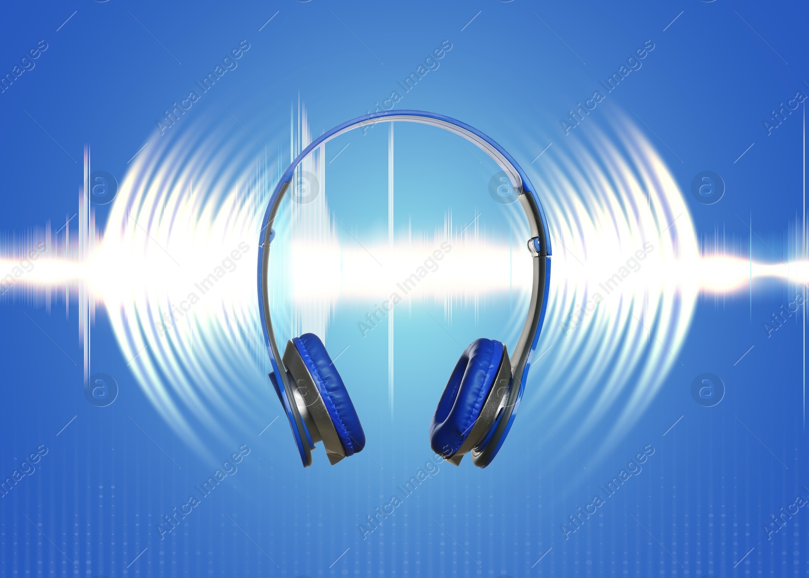 Image of Headphones and sound waves against blue background
