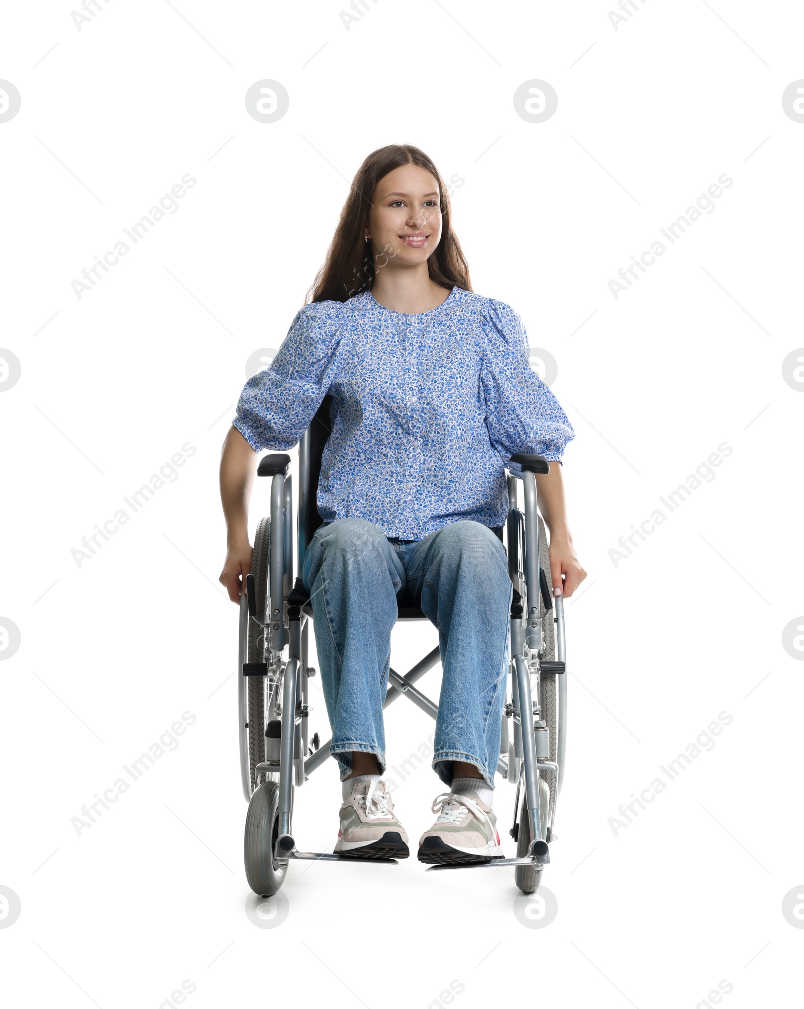 Photo of Beautiful teenage girl in wheelchair on white background