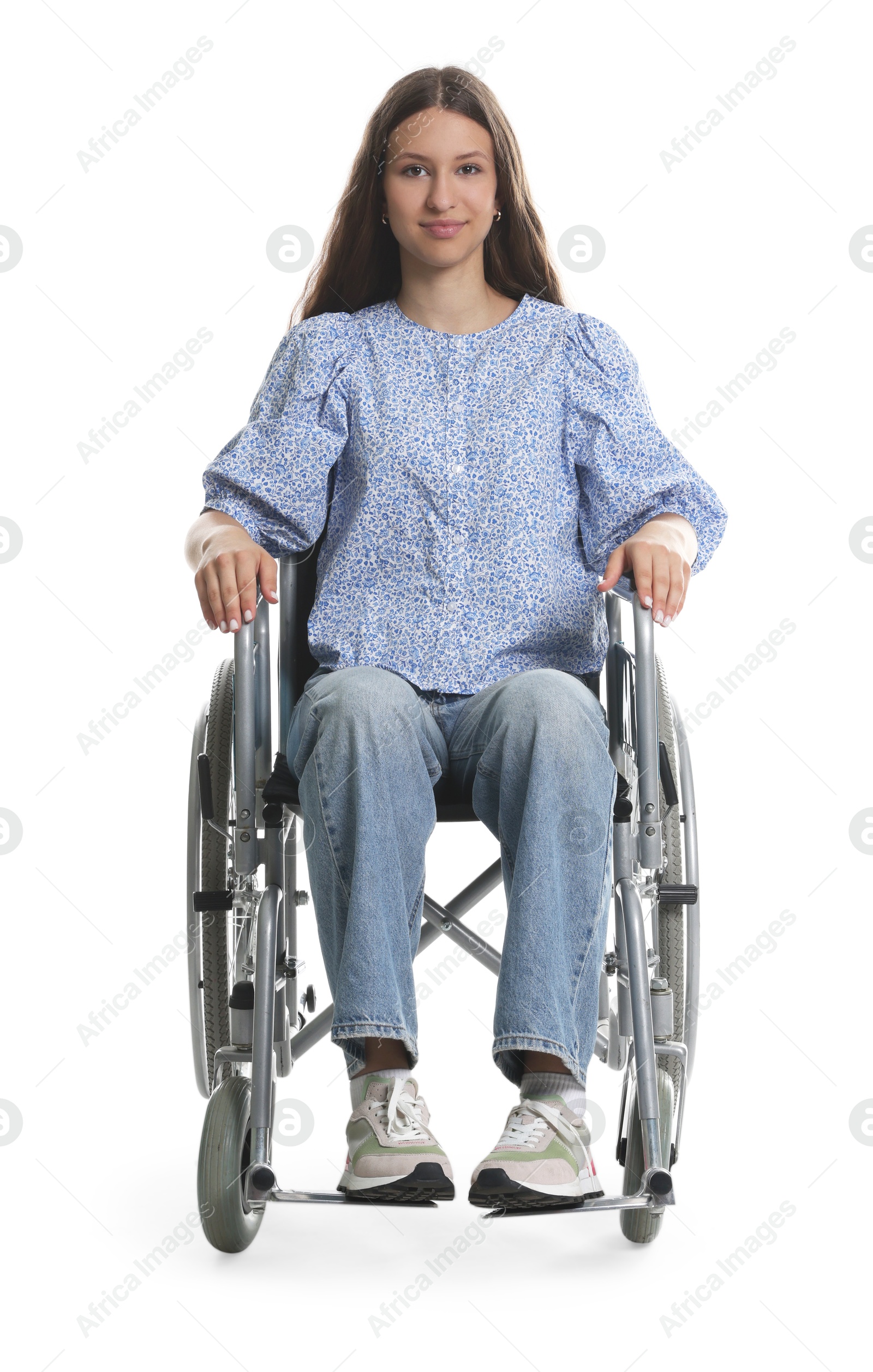 Photo of Beautiful teenage girl in wheelchair on white background