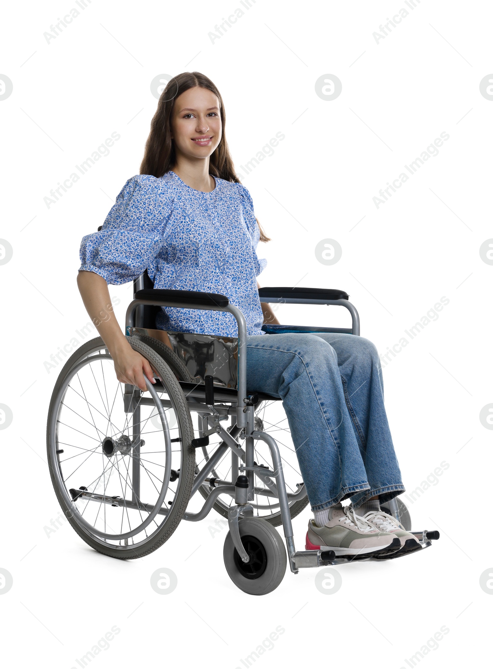 Photo of Smiling teenage girl in wheelchair on white background