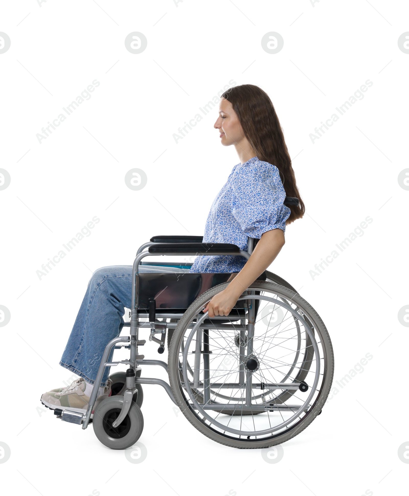 Photo of Smiling teenage girl in wheelchair on white background