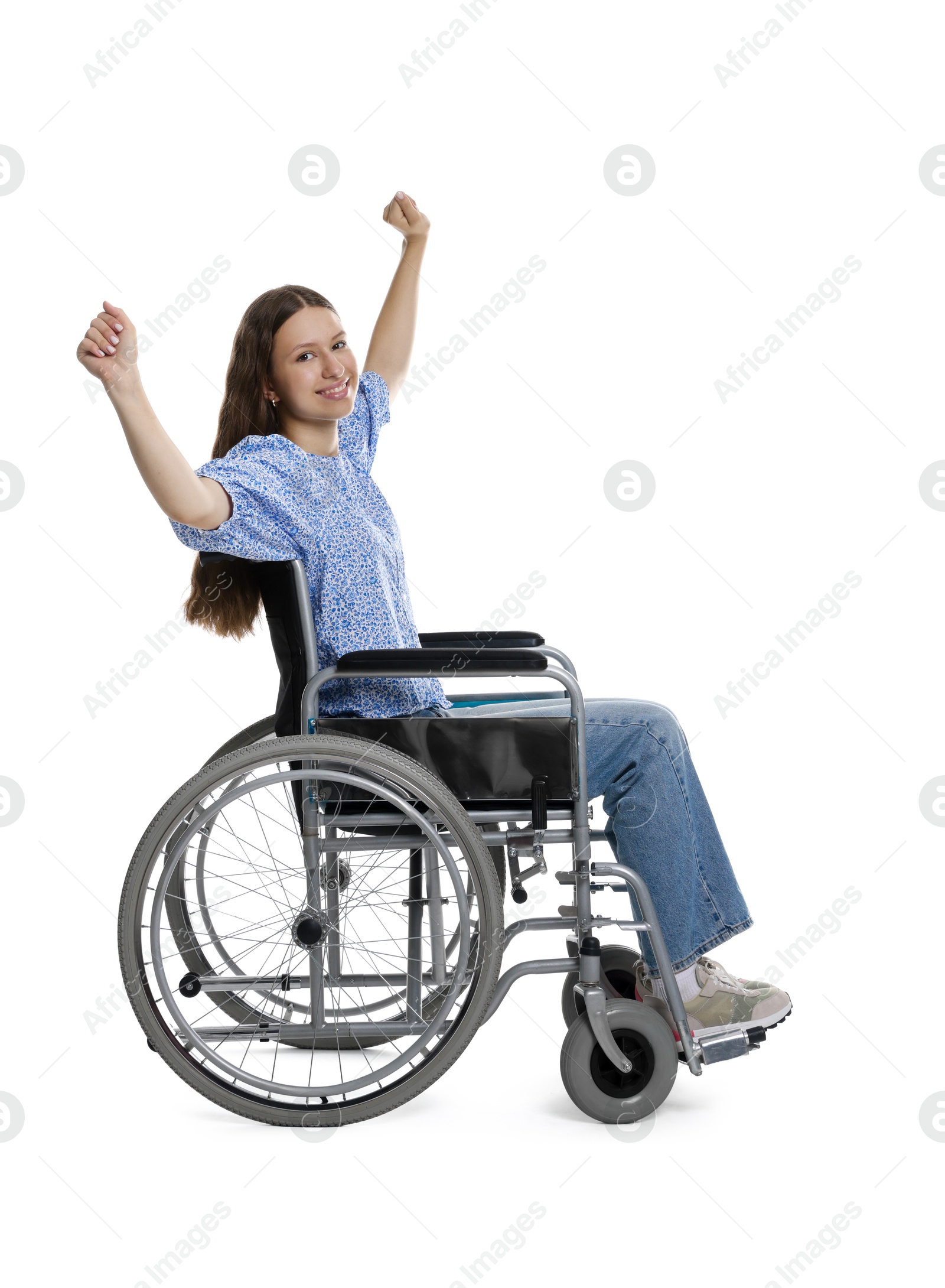 Photo of Smiling teenage girl in wheelchair on white background