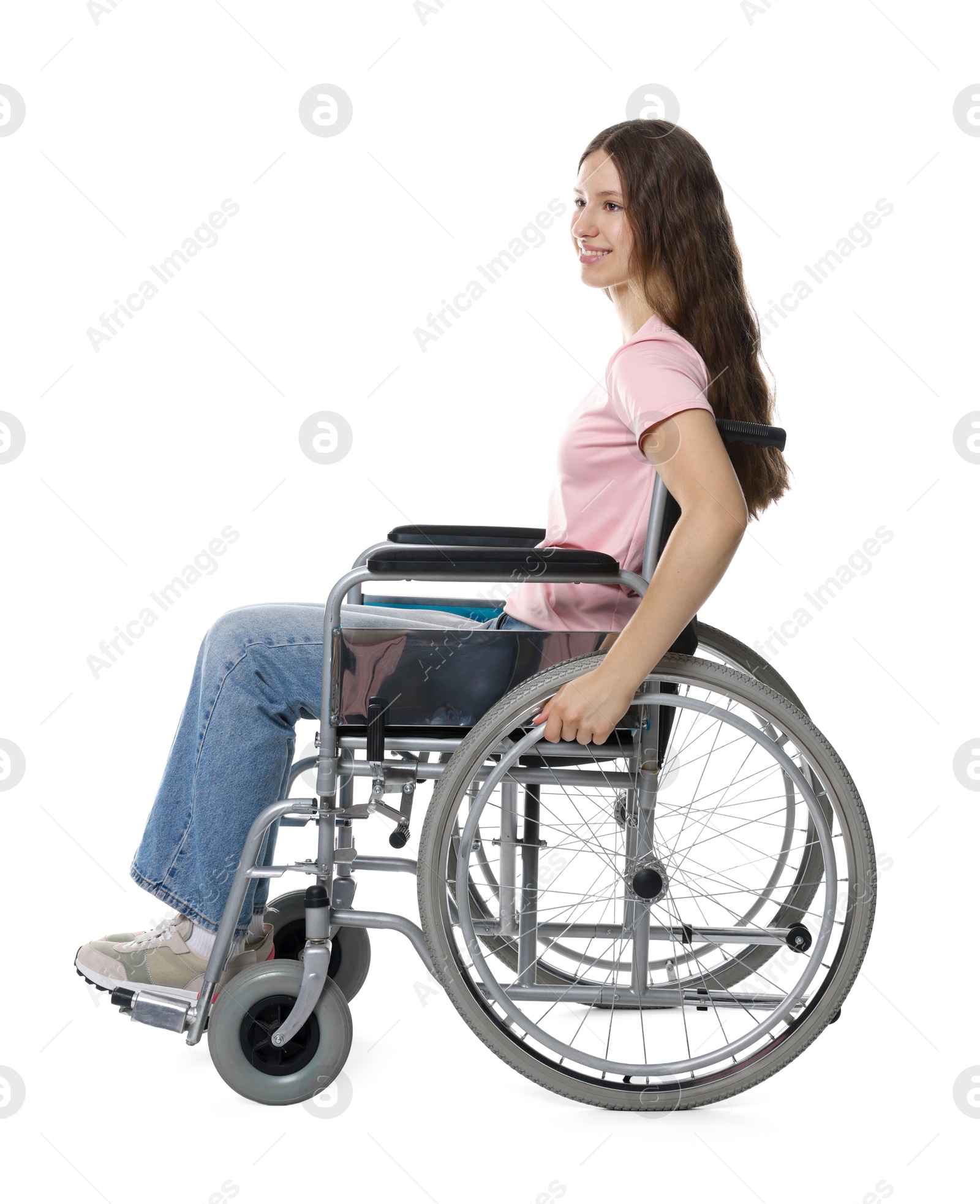 Photo of Smiling teenage girl in wheelchair on white background