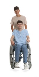 Photo of Happy young man in wheelchair and caregiver on white background