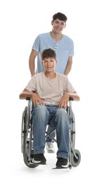 Photo of Happy young man in wheelchair and caregiver on white background