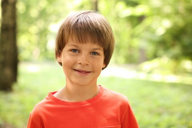 Photo of Portrait of cute little boy in park