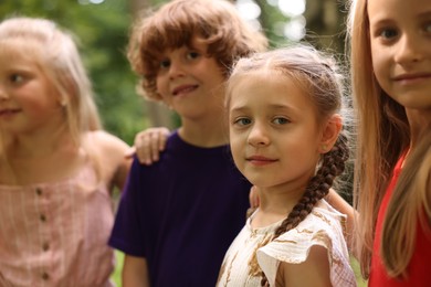 Photo of Group of cute little kids in park, selective focus