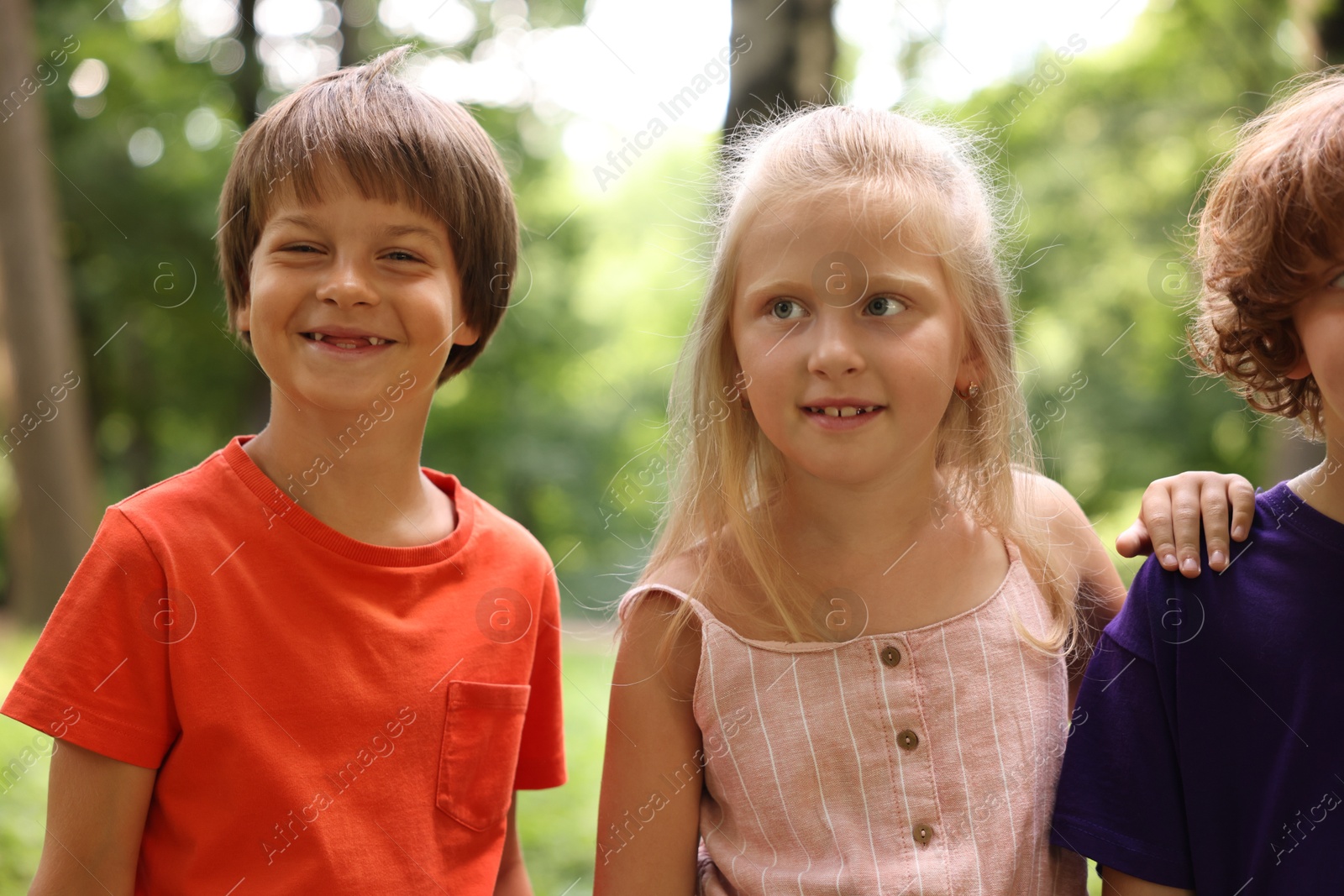 Photo of Cute little kids spending time together in park