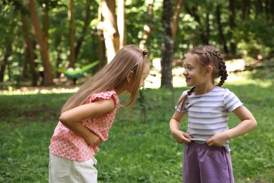 Photo of Cute little kids having fun together in park