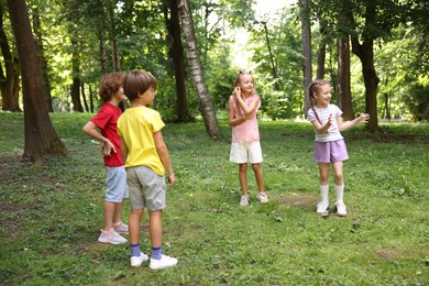 Photo of Cute little kids having fun together in park