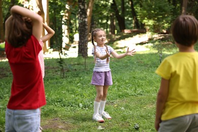Photo of Cute little kids having fun together in park