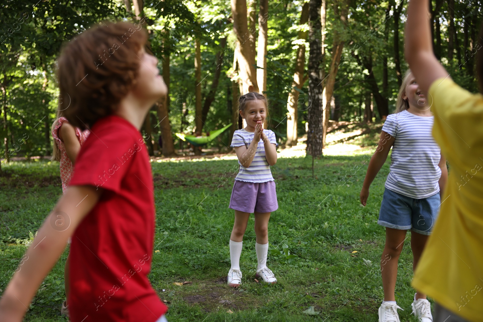 Photo of Cute little kids having fun together in park