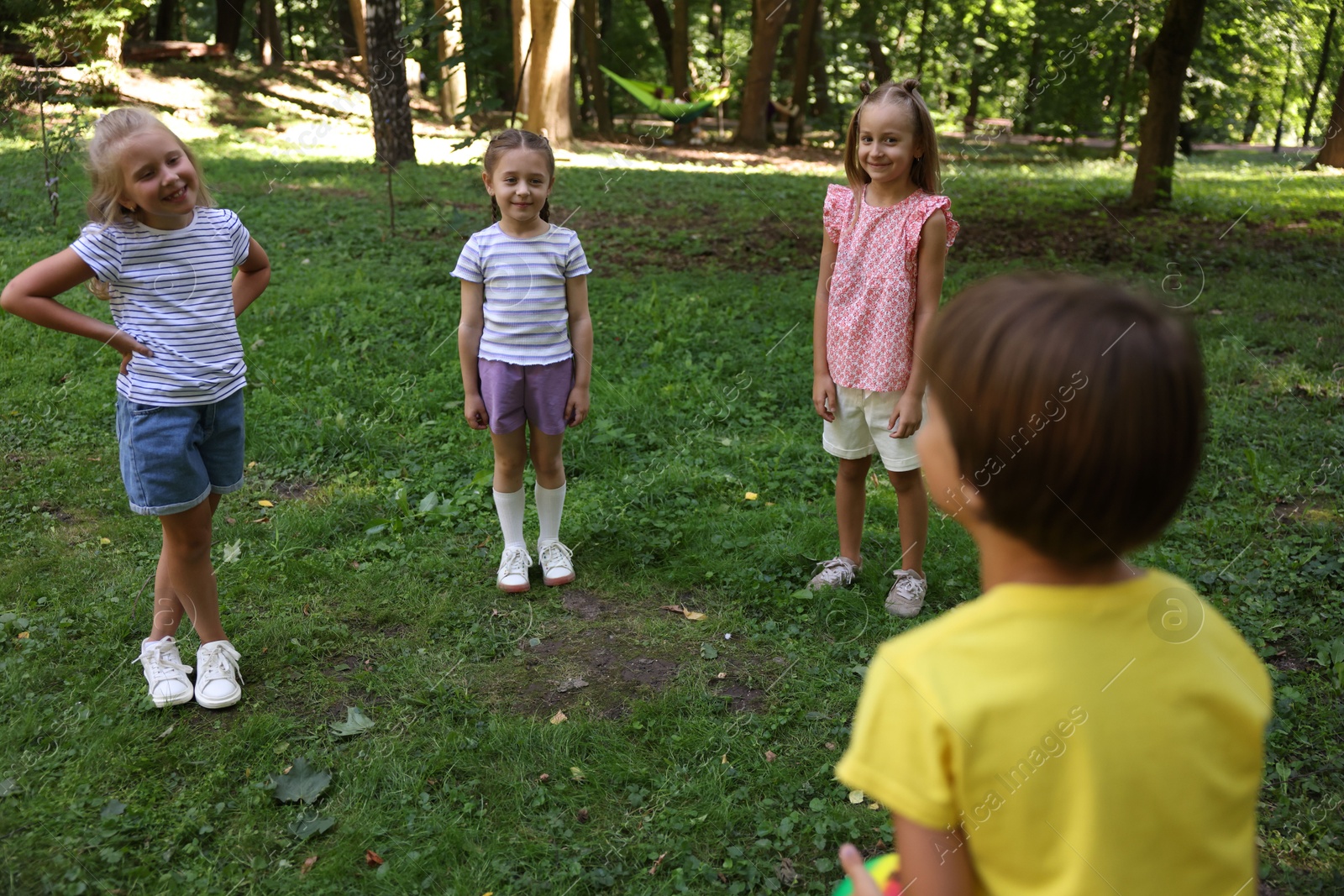Photo of Cute little kids having fun together in park