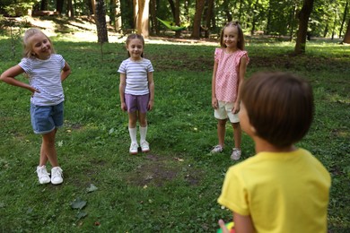 Photo of Cute little kids having fun together in park