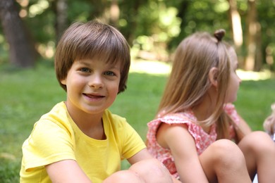 Photo of Cute little kids spending time together in park