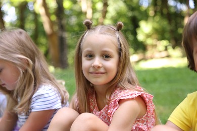 Photo of Cute little kids spending time together in park