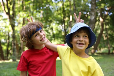 Photo of Portrait of cute little kids in park