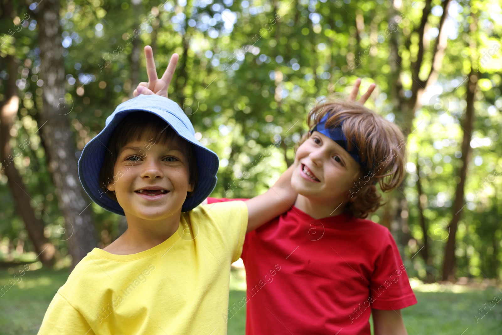 Photo of Portrait of cute little kids in park