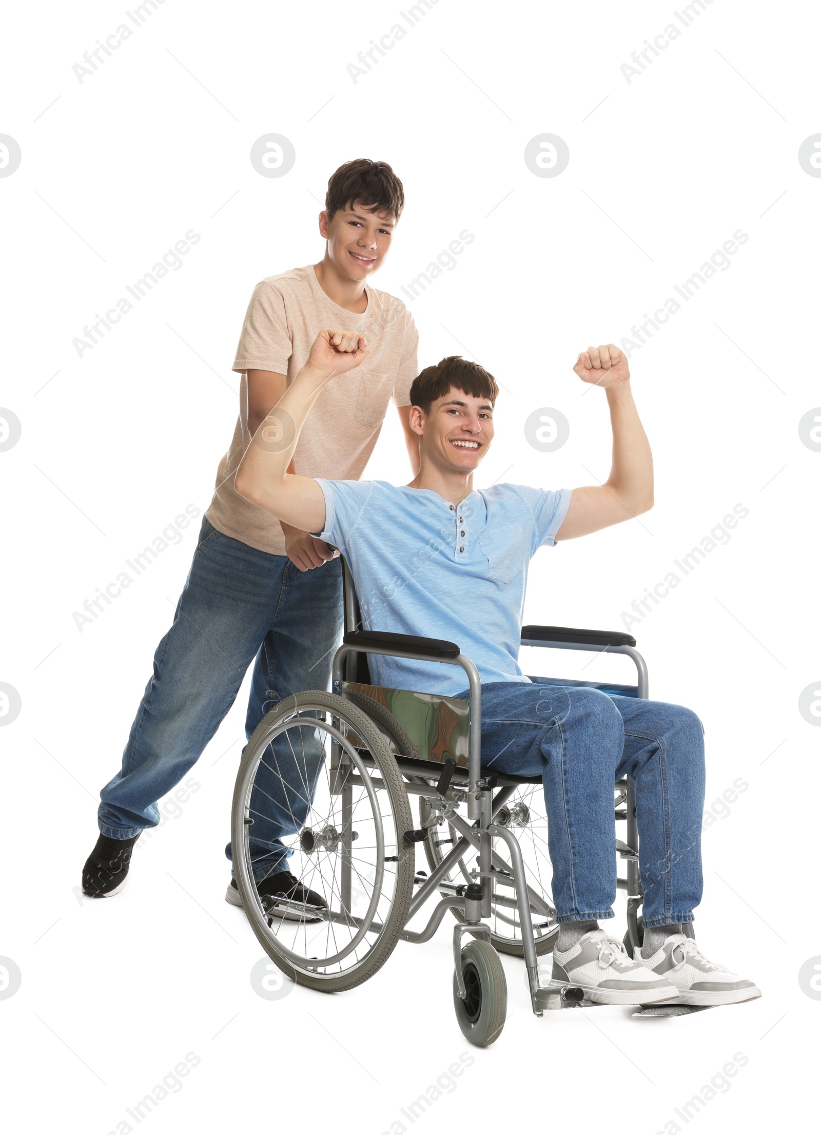 Photo of Happy young man in wheelchair and caregiver on white background