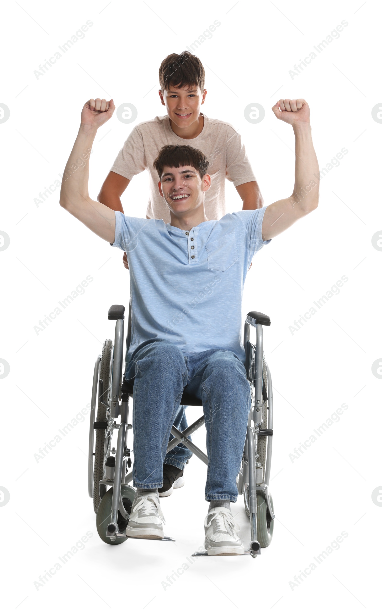 Photo of Happy young man in wheelchair and caregiver on white background