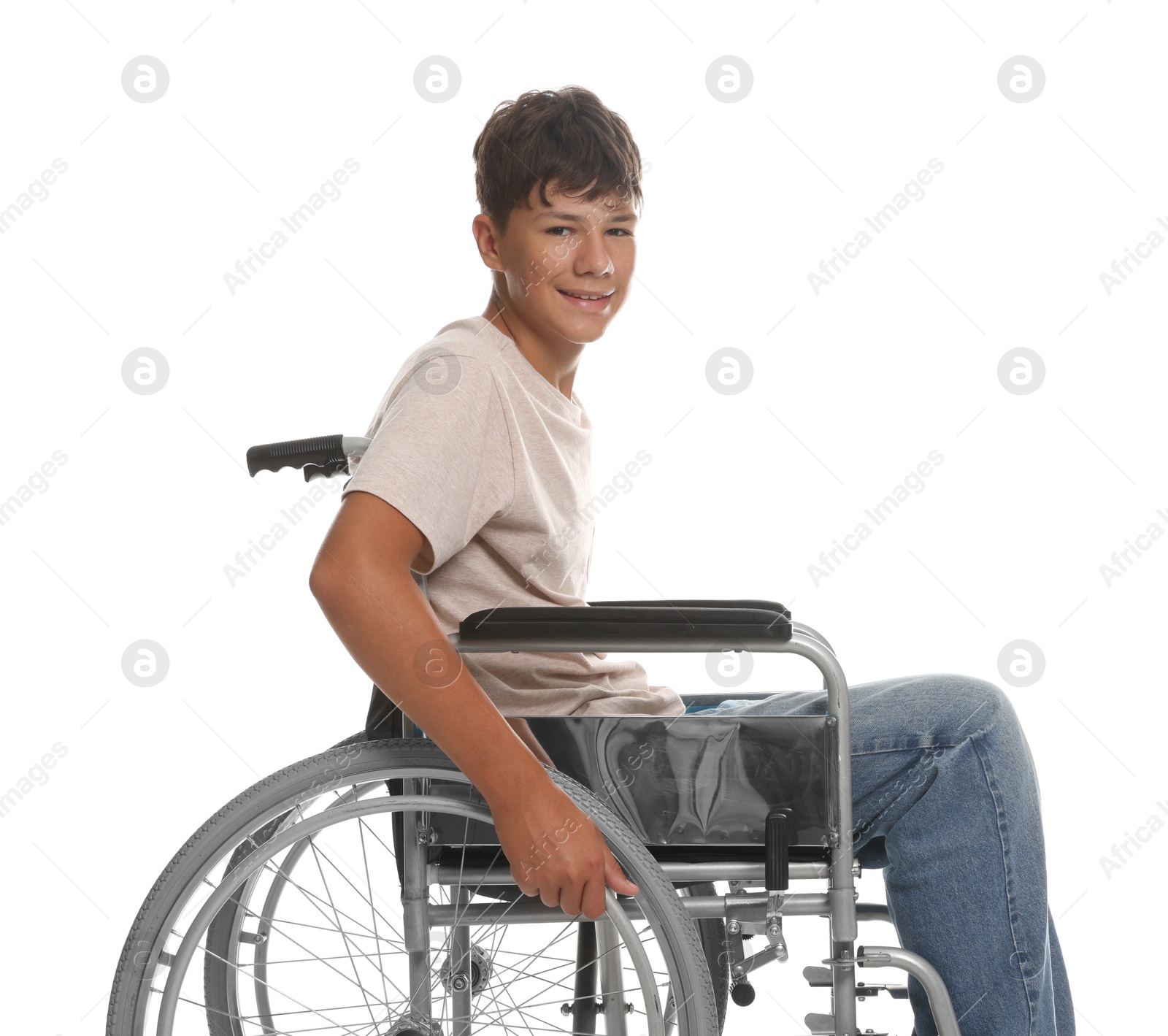 Photo of Happy teenage boy in modern wheelchair on white background