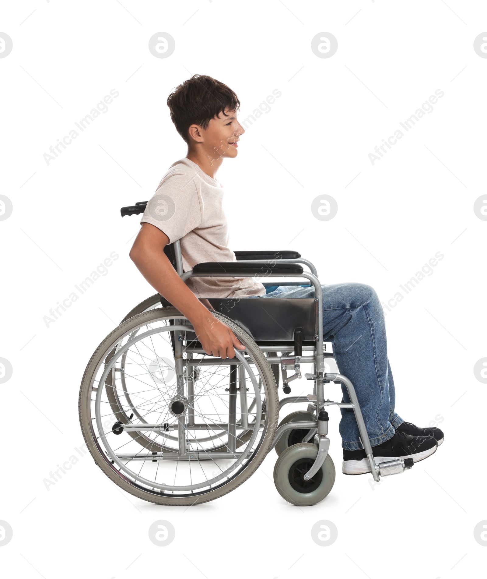 Photo of Happy teenage boy in modern wheelchair on white background
